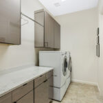 Gray gloss laundry room cabinets