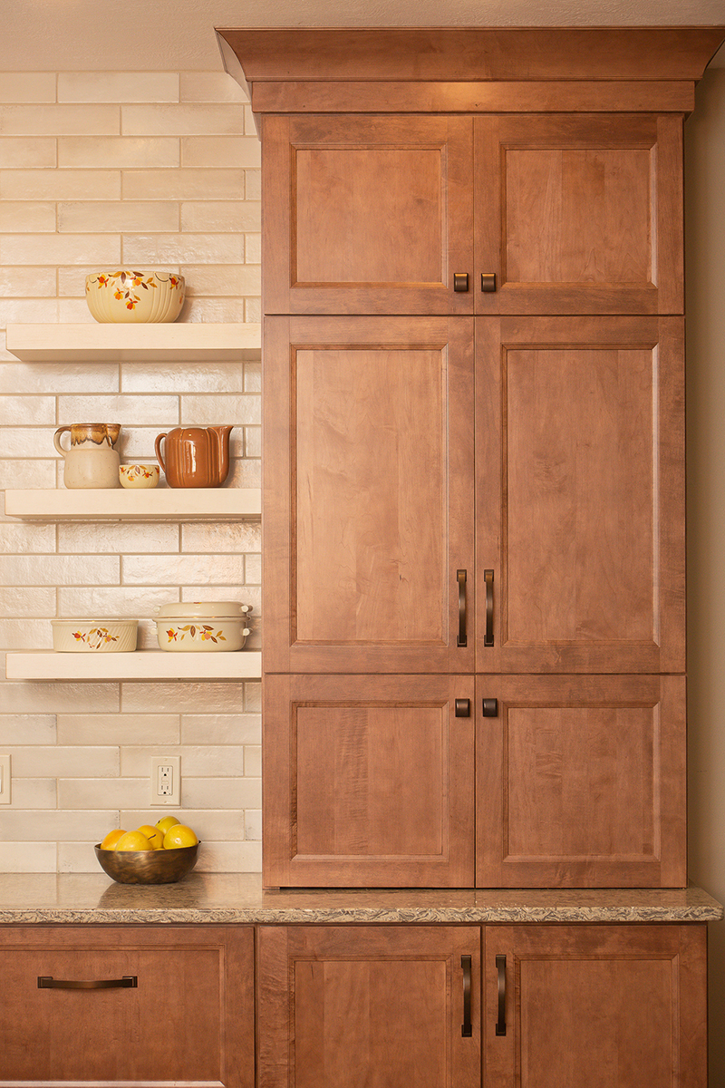 Warm stained and white kitchen cabinets