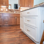 White and Warm stained kitchen cabinets