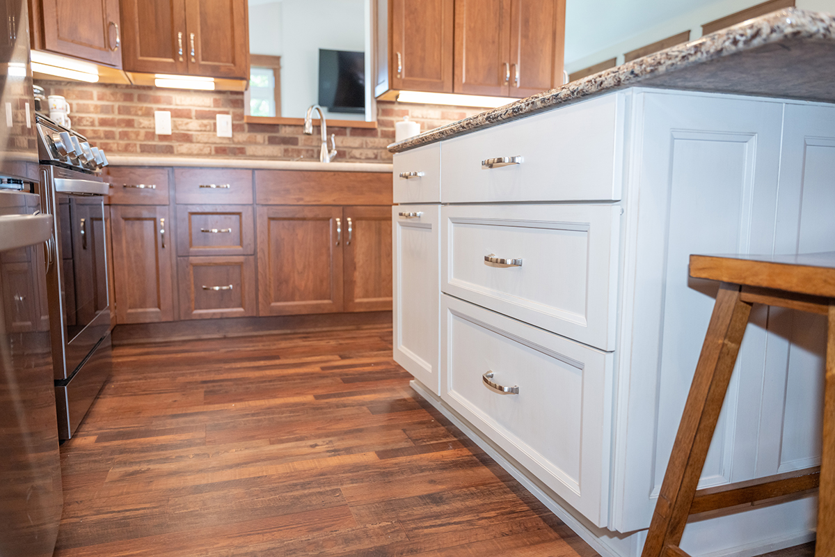 White and Warm stained kitchen cabinets