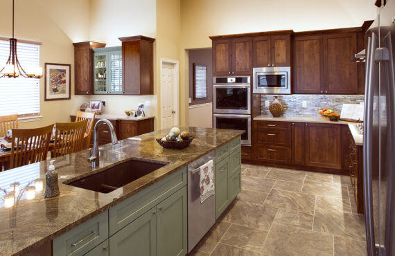 Dark stained and green kitchen cabinets