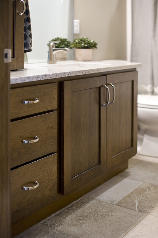 Dark stained bathroom cabinets