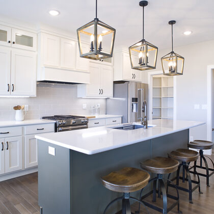 white kitchen cabinets and gray island