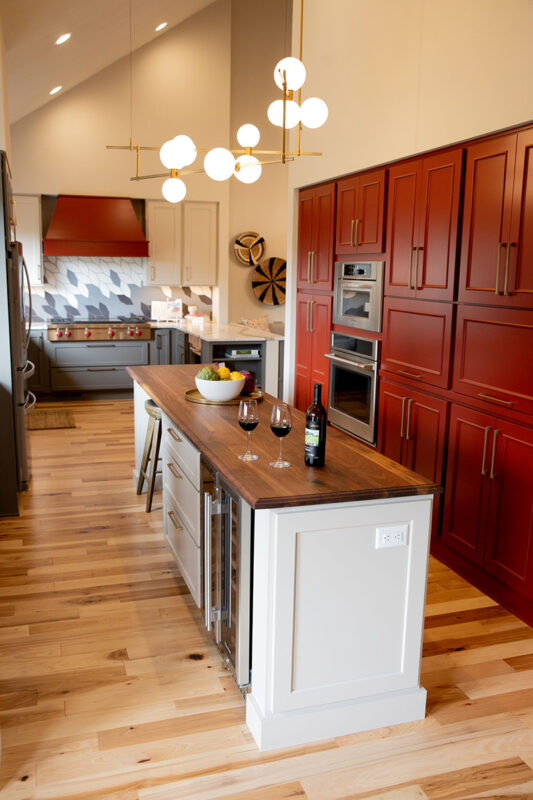 Red, white and gray kitchen cabinets