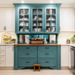 White and teal kitchen cabinets