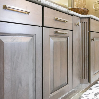 Dark stained bathroom cabinets