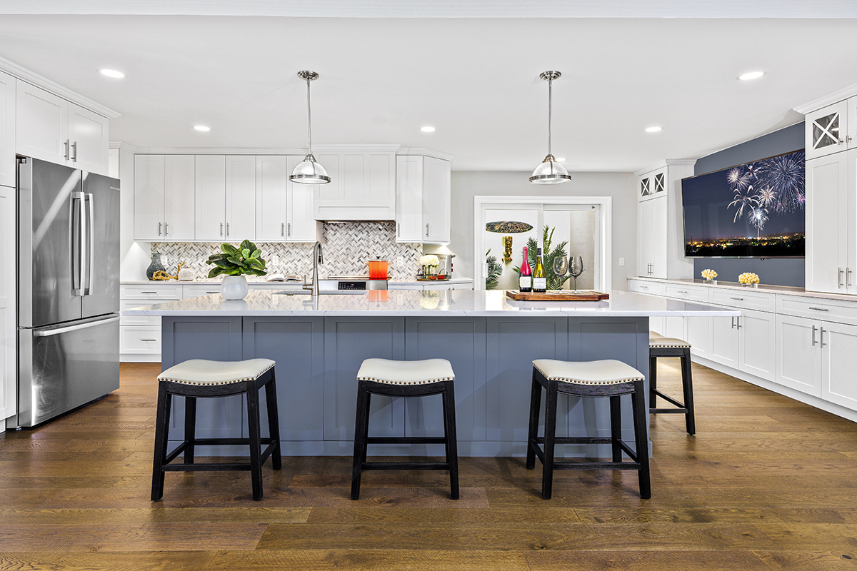 Blue island and White kitchen cabinets