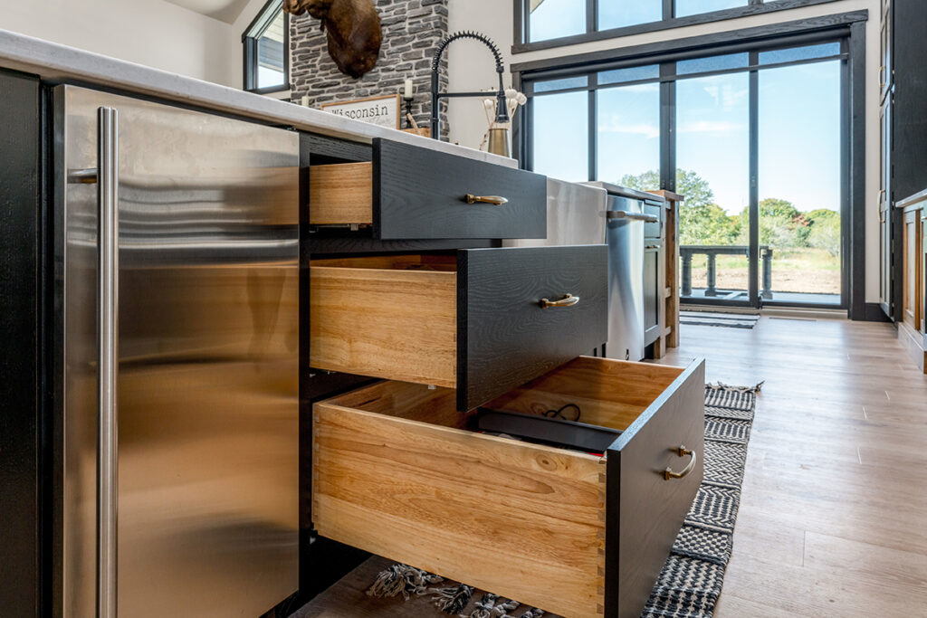 View of Black Cabinets With Gold Hardware - Showplace Cabinetry