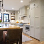 Brown stained and white kitchen cabinets