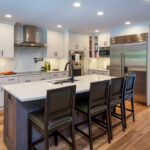 Dark stained Island and White kitchen cabinets