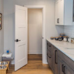 Dark stained and white bathroom cabinets