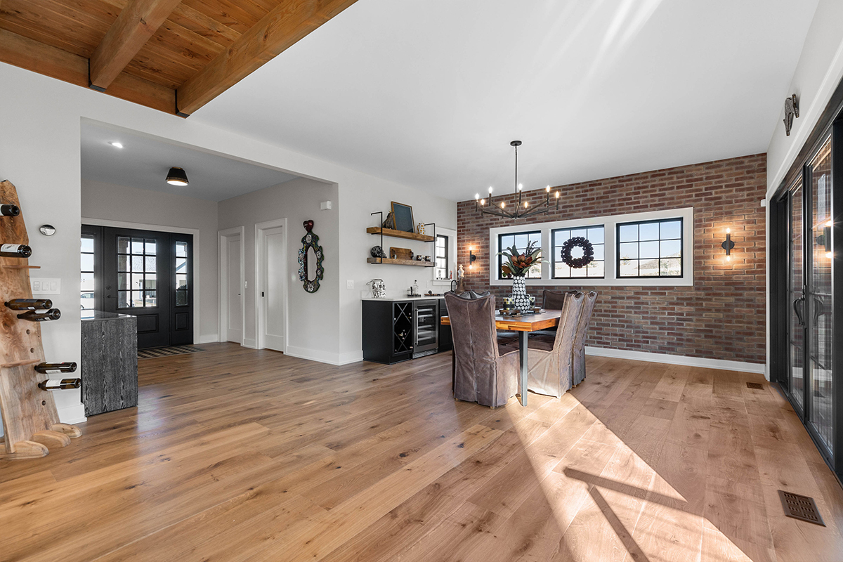 open entryway and dining table, brown hardwood floors