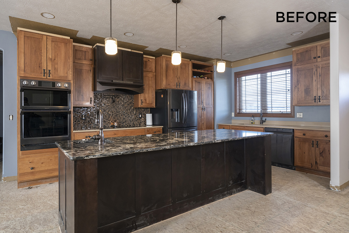 Before view of the kitchen with dual tone cabinets.