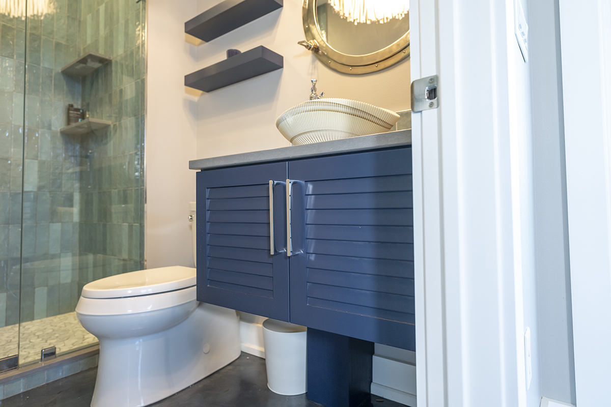 shows royal blue under sink cabinets with silver handles