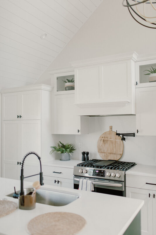 Another angle of the white cabinets with the white ceiling feature.