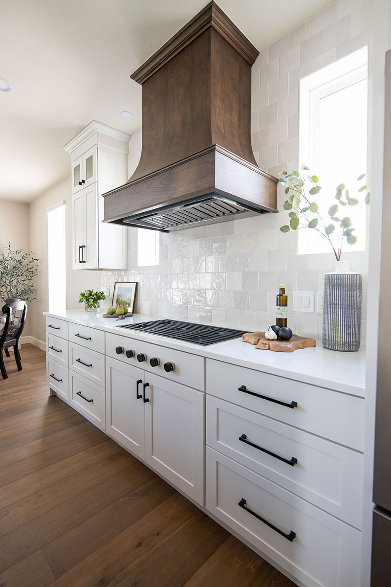 White Paint Grade Cabinets Surround Cherry Kitchen Island