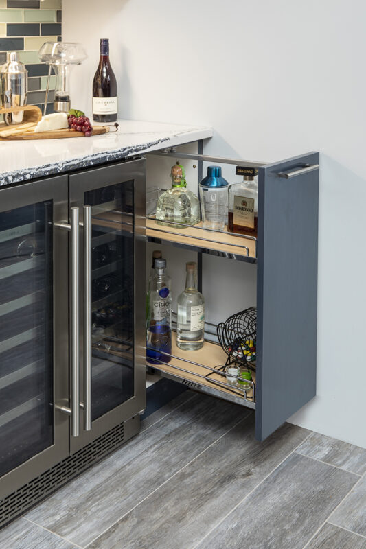 gray wooden liquor cabinet with stainless steel fridge.
