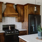 dark walnut kitchen cabinetry with white stone vanity
