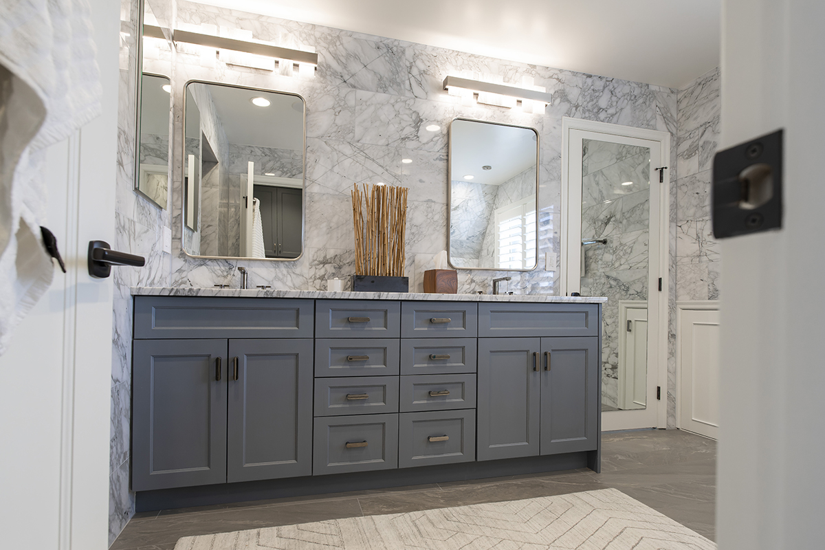 gray bathroom cabinetry with multicolored bathroom vanity
