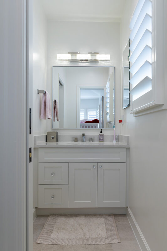 white bathroom vanity and cabinets