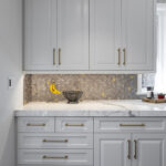 white kitchen vanity and cabinets with gold accents
