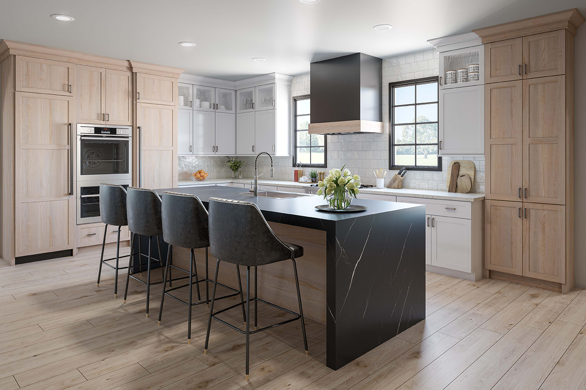 Pampas kitchen with dual tone cabinets and black countertops.