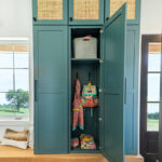 entryway with teal colored closet storage