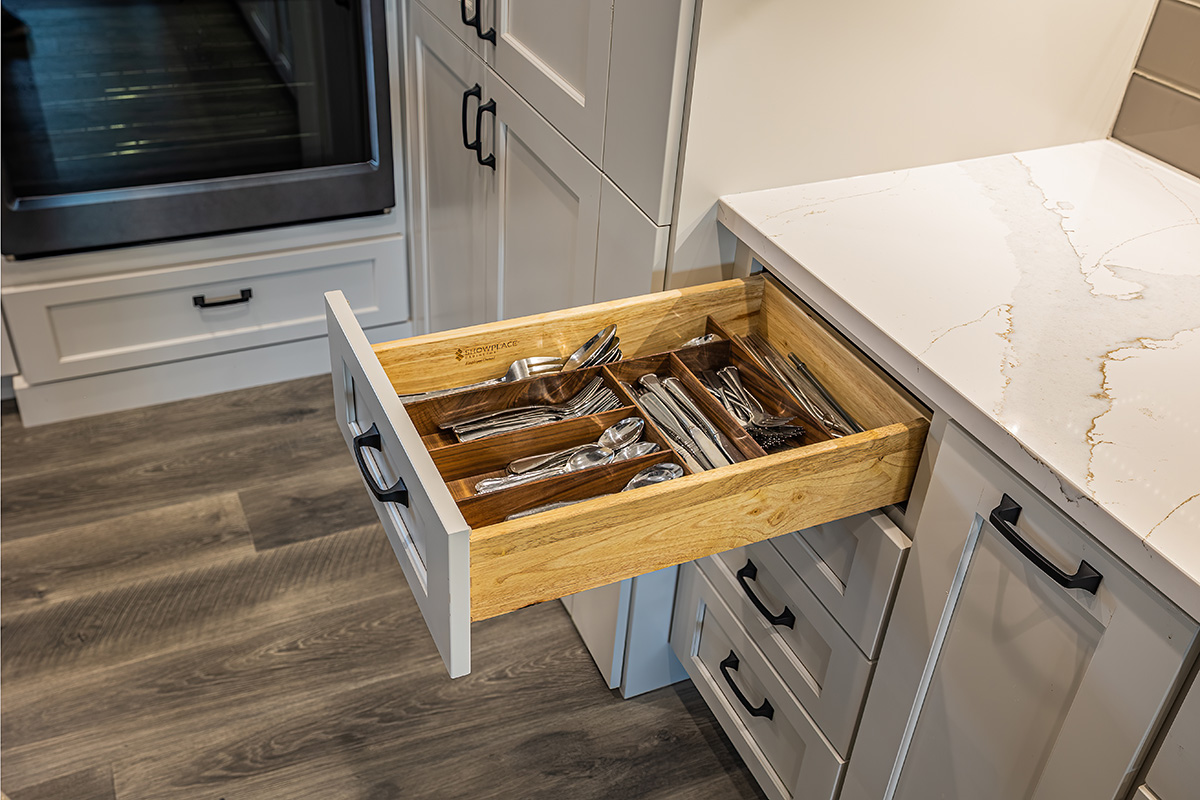 kitchen utensils drawer inside white kitchen cabinets