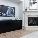 Black cabinets and fireplace