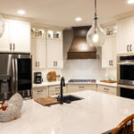 Small white kitchen with stained island