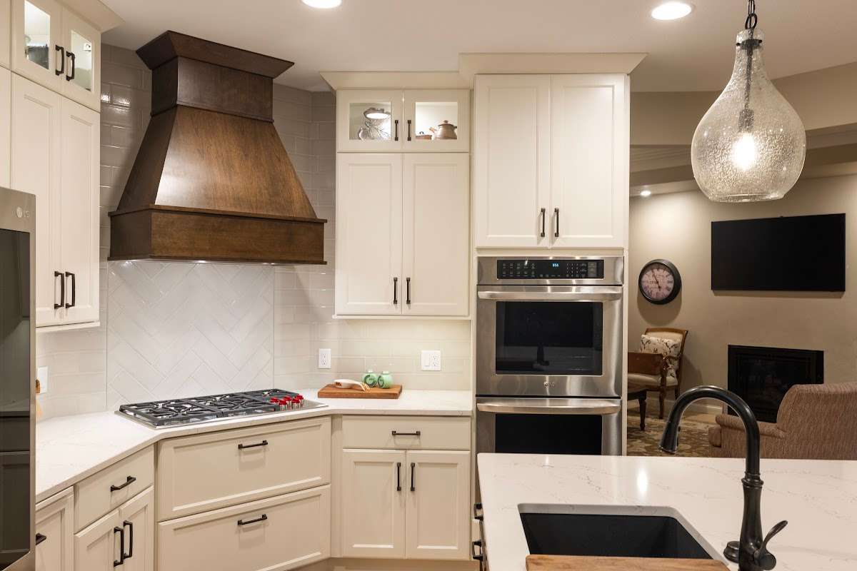 Small white kitchen with stained island