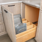 Tray divider pull out base