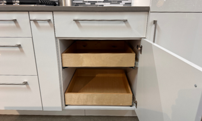 Frameless base cabinet with roll trays