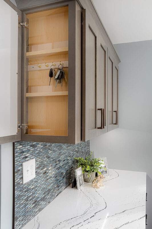 Wall cabinet with side opening storage