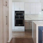 White and stained kitchen cabinets