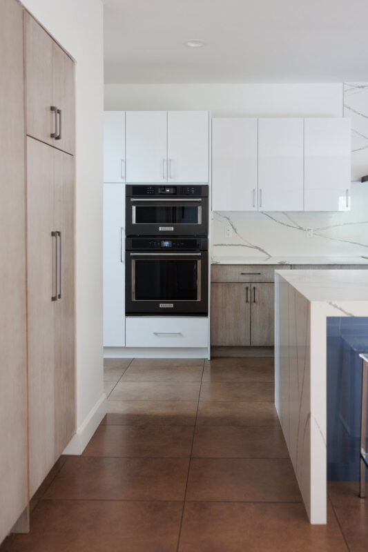 White and stained kitchen cabinets