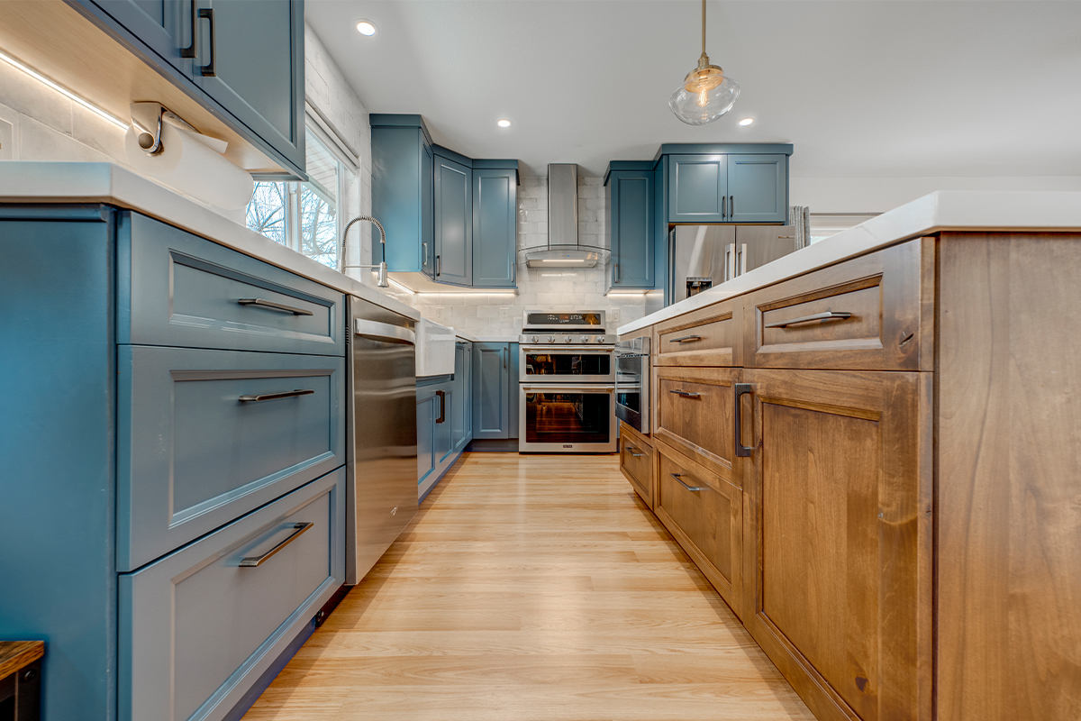 Blue painted kitchen with stained island