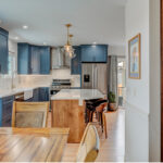 Blue painted kitchen with stained island