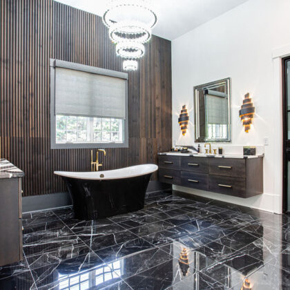 Stained master bath with floating vanities and free standing tub