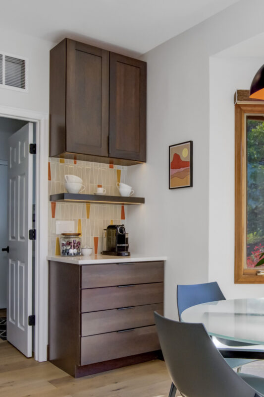 Stained kitchen cabinets with island.