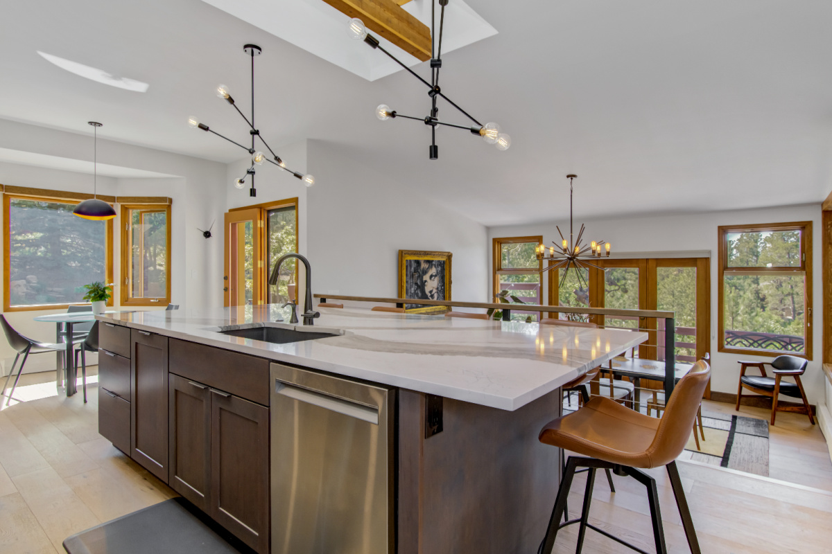 Stained kitchen cabinets with island.