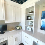 Painted white office cabinets.