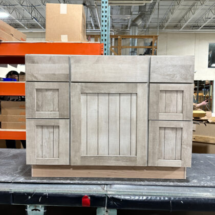 Tall combination sink with three drawer base vanity in maple finished with Montana stain