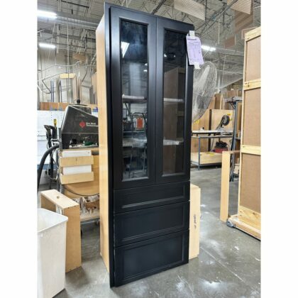 Utility cabinet with 3 drawers painted black with doors with glass inserts