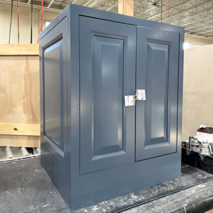 Standard base cabinet with full height door and fixed frame and door and flush toe kick. Painted in Smokey Blue paint.