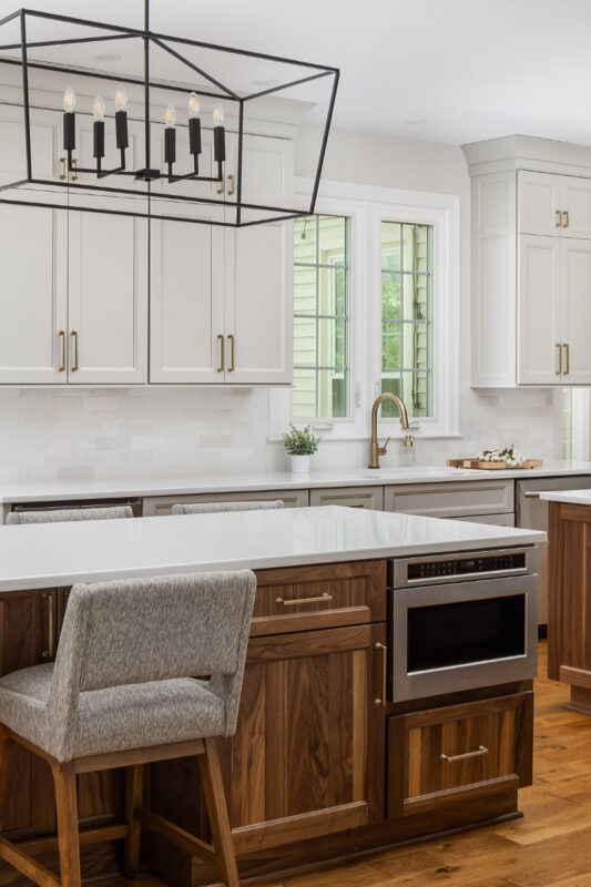 Painted kitchen cabinets with stained double islands