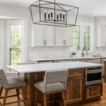 Painted kitchen cabinets with stained double islands