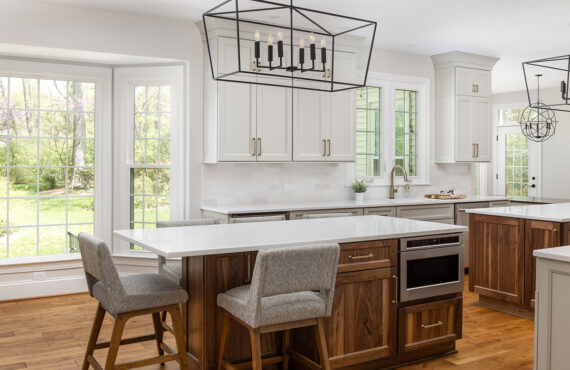 Painted kitchen cabinets with stained double islands