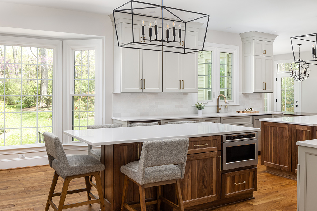 Painted kitchen cabinets with stained double islands