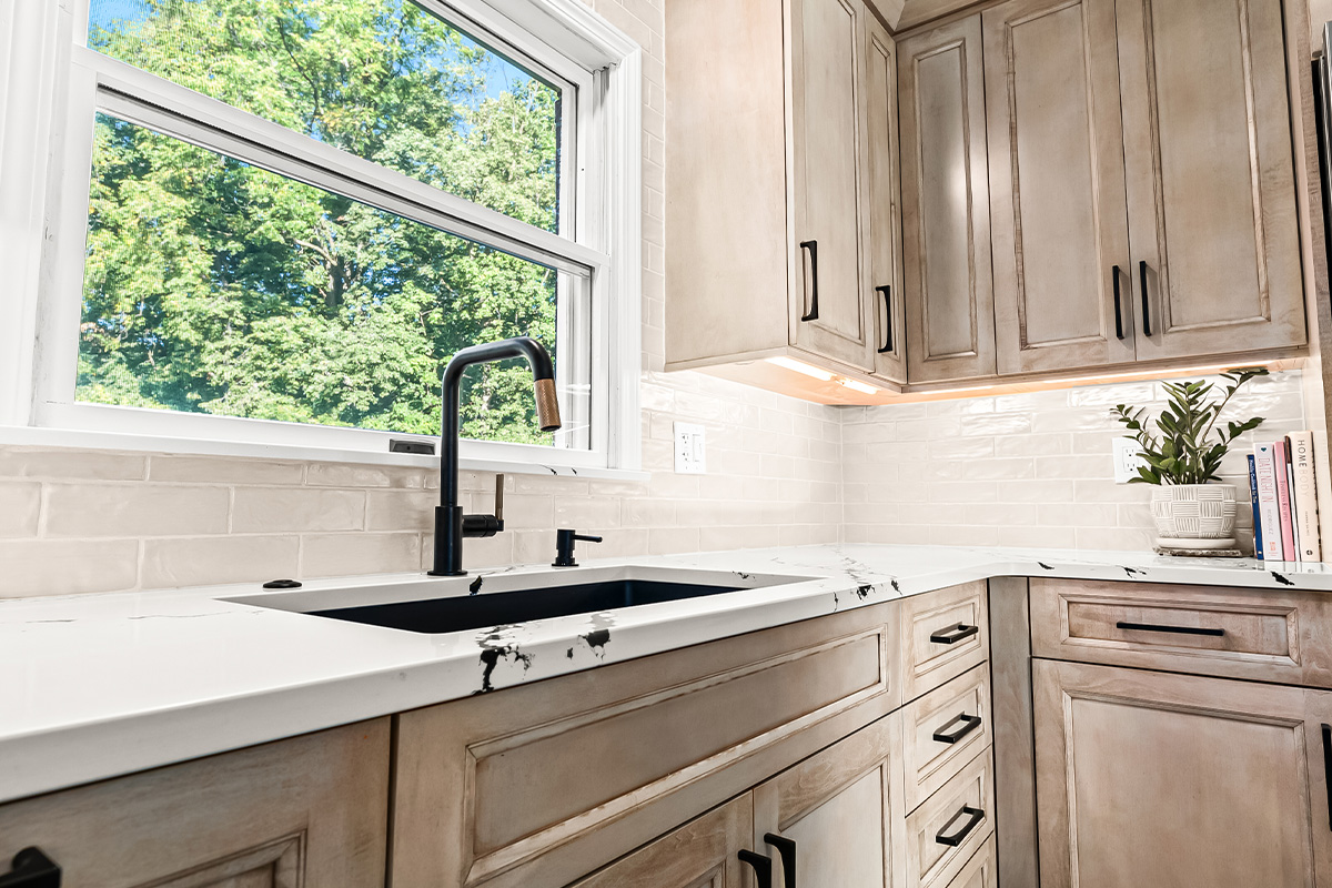 Stained kitchen cabinets with painted island